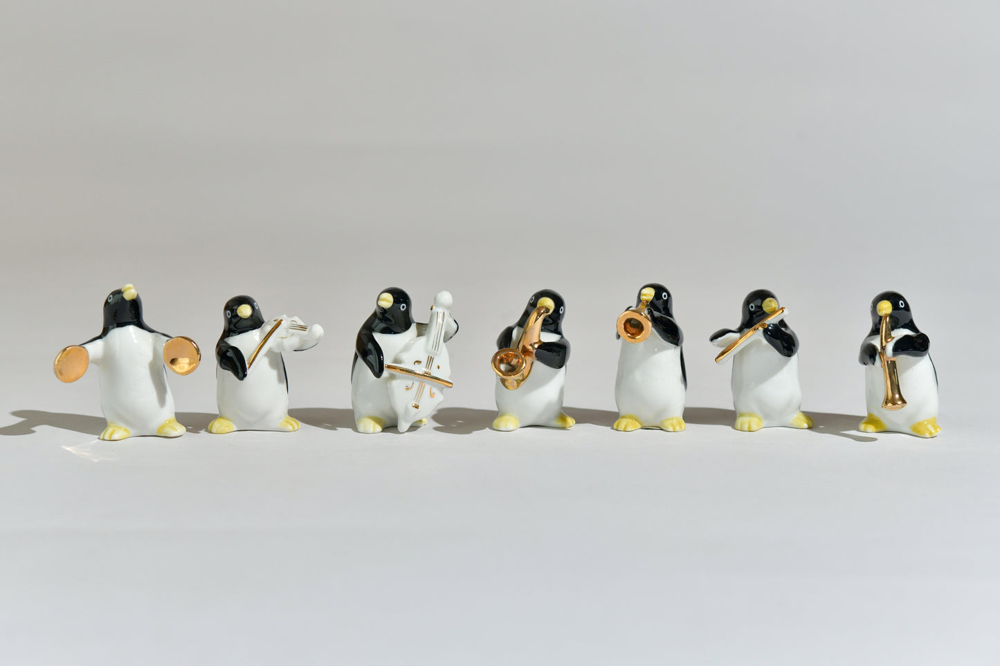 Set of 7 Pottery Penguins Orchestra Collection